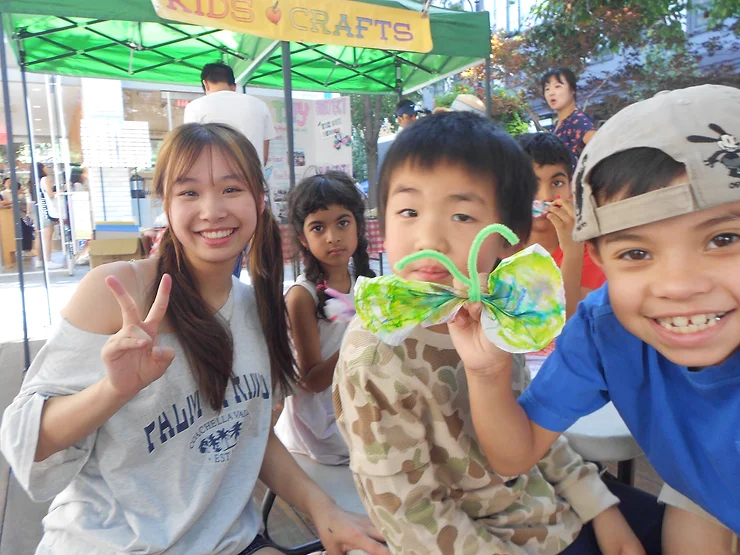 Grace Huang and her students in Santana Row posing after finishing their butterflies