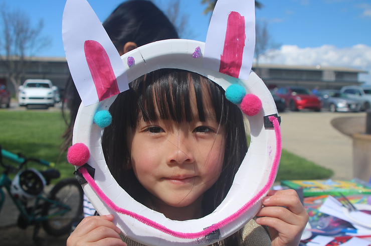 A girl holding up her finished product