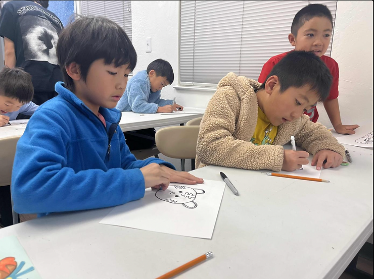 Morning Star students tracing and coloring in drawings of tigers