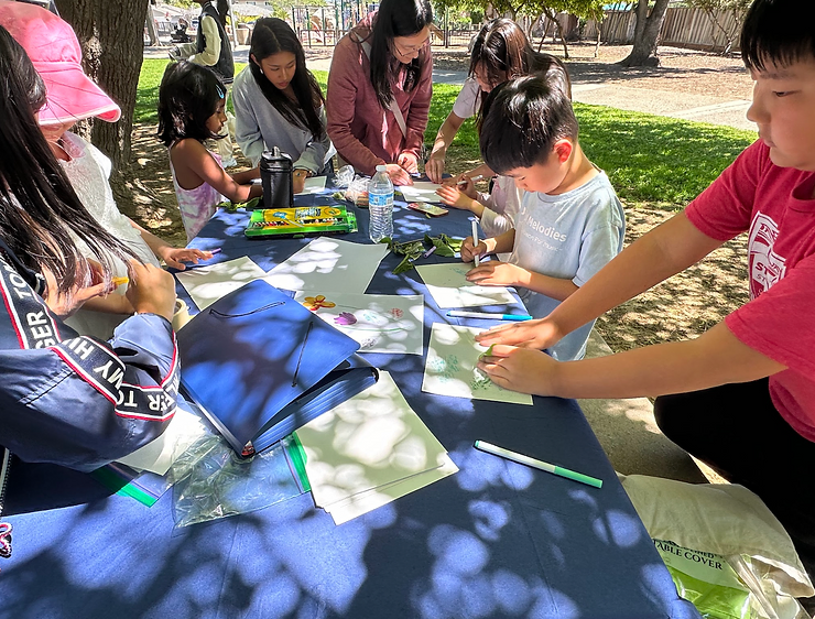 Participants transform simple leaves into intricate patterns